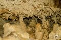 The left-hand side of the cave is full of small columns and stalagmites.