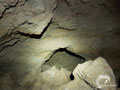 The main room of the cave has 7 small chambers and several big rocks in the centre. 