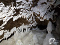 Crawling is necessary to explore the left-hand side of the cave (September 2019).