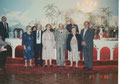 In visita agli emigrati in Australia. 27/07/1986. Si riconoscono, con Padre Di Mauro al microfono sullo sfondo, in prima fila a partire dalla sinistra: il signor Vecchio (2°), i fratelli Correnti (5° e 6°).