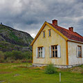 Old pastor's house, which was occupied by germans during WW II. In the background, there is the Norwegian watchtower.