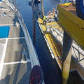 Hanging five meters above the water - ready to check inside the boat for any leaks