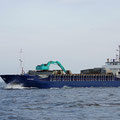 Crossing the path of a working boat, on the way to the outer islands. Every thing ist transported by boat.
