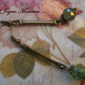 PC118  cuenta cristal verde y bronce 6,5cm