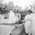 Manu and Mahatma Gandhi interact at Noakhali, c. November 1946.