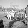 Mahatma Gandhi and party during his visit to the riot-stricken areas in Noakhali, January 1947. Also be seen: Jivan Singh (with turban; member of Indian National Army).