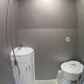 extra large bath room, there is enough leg space when using the toilet or having a shower