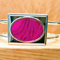 Pink encapsulated adjustable bangle