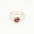 Silberring 925 mit in Gold 750 gefasstem Sternrubin, 1067.-