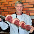Grill chef with huge Churrasco (grilled meat on spits) ready for grilling, Churrascaria Ipiranga, Bento Gonçalves