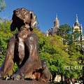 Bronze dog of Marechal Deodoro Square in the historic center of Porto Alegre with towers of the Cathedral in the background
