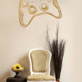 Gold wall art sticker on a living room wall of a hand drawn game controller for the xbox decal