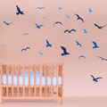 Small, Medium and Large pack of Eight Seagulls vinyl wall art on a baby's room wall.