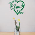 Mr & Mrs Smith are in love, surrounded by a love heart vinyl wall art from www.wallartcompany.co.uk