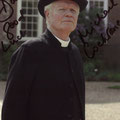 Michael Cochrane as Reverend Travis