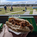 2022 05 08 Sporting Clays competition. Oh man, Anita's pulled pork rolls were excellent. Twelve hours in the slow cooker. It looks like Ian & Marion got a whiff of it and are walking off to the canteen to get one.