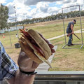 2022 04 10 Sporting Clays Competition - An army marches on its stomach, but Wang Gun Club volunteers march on Anita's egg and bacon rolls. Malcolm Hill seems to be genuflecting to the Sporting Clays Gods.