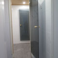 Entrance to the bath area, smoke glass doors. Warm water boiler on the left (not visible)