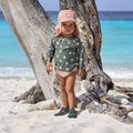 Baby am Baum im Sand mit Schwimmwindel von LÄSSIG Splash & Fun