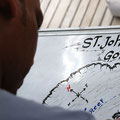 St. Johns Tour - our Guide and Artist Maldini painting the map. photo @ Johnnie Moon