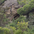 Right hand side rock cave. 