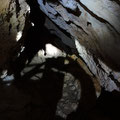 In the central part of the cave on the right side hand, there is a small opening. The depth of it is unknown. No air emerges. 