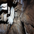 At the bottom of the vertical cave there are some wall decorations. 