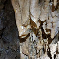 Decorations on the bottom of the room on the left-hand side of the cave.