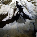 On the right hand side of the cave there is a small but deep opening. 