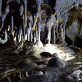 On the left hand side of the cave there is a water stream with lots of stalactites. 