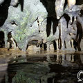 On the left hand side of the cave there is a water stream with lots of stalactites. 