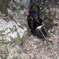 Descending the vertical cave. 