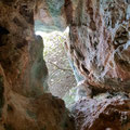 Inside a small lower located cave. 