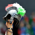 An Italy supporter holds up a mockup of a ancient Roman helmet with plumes in the Italian colours ahead the Euro 2016 match between Italy and Sweden at the Stadium Municipal in Toulouse on June 17, 2016. (AFP/Pinto)