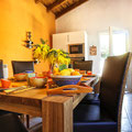 Sunny & inviting dining room with kitchen