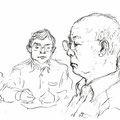 法廷で毅然と証言する小山さん（後ろは九電弁護士）