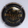 Marque : DRAPPIER N° Lambert : 21 Couleur : Noir et or mat, verso or. Liseré sur contour  Description : Drappier sur armoiries surmontée d'une couronne et soutenue par deux lions  Emplacement : 