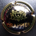Marque : DRAPPIER N° Lambert : 3 Couleur : Noir, grand écusson.  Description : Inscription Drappier sur armoiries surmontée d'une couronne et soutenue par deux lions  Emplacement : 