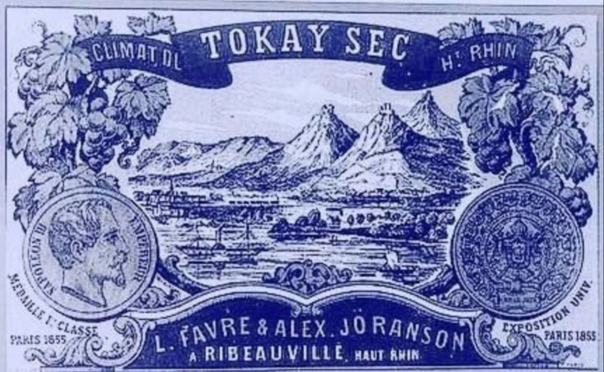 La médaille de 1ere Classe de l'Exposition Universelle de Paris 1855 figure sur cette magnifique étiquette de Tokay sec Climat du Haut Rhin, L. Favre & Alex. Jöranson à Ribeauvillé