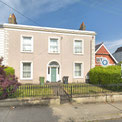 Left is Rossmore Cottage today with the former Brethren Hall built in the 1860s alongside