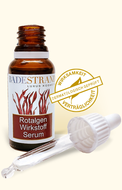 Produktabbildung: „Rotalgen Anti Rötungsserum“ Motiv rote Algen, im Braunglasfläschchen 20 ml, mit Pipettenspender. Mit „Siegel – Wirksamkeit und Verträglichkeit dermatologisch geprüft“.