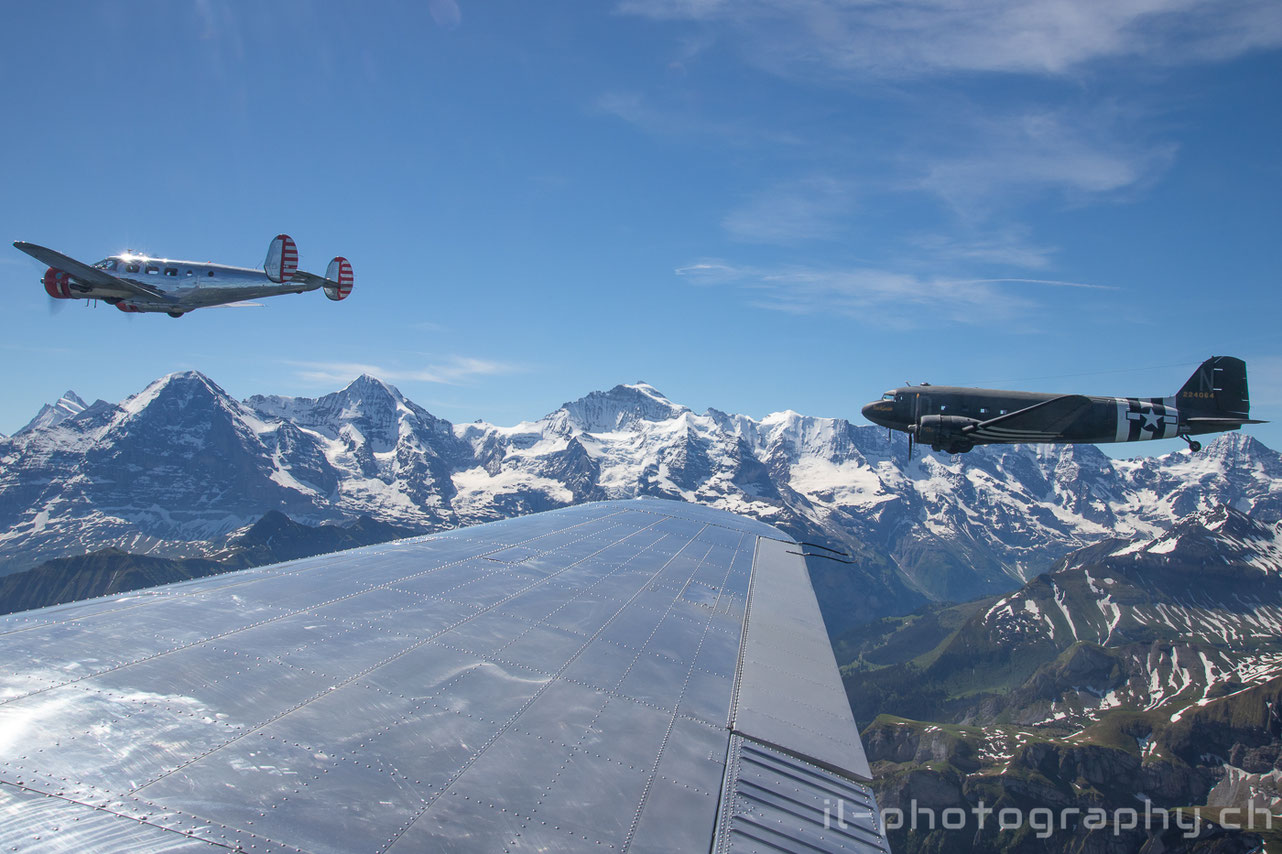 Douglas DC-3 C-47 Placid Lassie and two Classic Formation Beech 18 in the Swiss Alps.