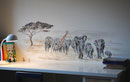 Pequeño mural infantil sobre escritorio.