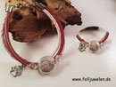 AB 5: Glasperle 16mm gefüllt mit Tierhaar und verschiedenen Lederbändern nach Wunschfarbe. Angebracht ist eine Pfote aus 925er Silber. Verschluss aus Edelstahl. Preis: 52 Euro