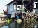 Subsistenz - Tonle-Sap-Familie auf schwimmenden Haus