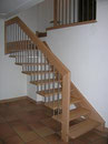 ¼ gewundene Treppe in Buche mit Chromstahlstaketten