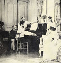 Debussy al piano. Tras él, el compositor Ernest Chausson