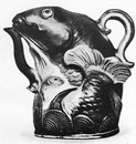 Aiguière de porcelaine en forme de poisson. Décor en trois couleurs sur biscuit. Les trois couleurs habituelles de la classe San ts'ai, brun-rouge, vert et jaune.