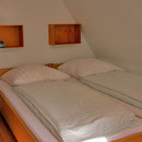 Amrum - Betten im Schlafzimmer der Ferienwohnung