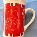 Royal Norfolk mug with white Christmas holiday designs in red background.  